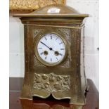 An Arts & Crafts brass cased mantel clock with French movement, 13"