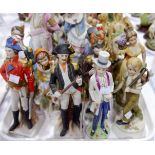 A 19th century French pair of coloured bisque figures of dancers in period dress; other figures