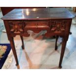 An 18th century oak lowboy with 3 drawers, on club legs