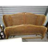 A pair of French 19th century style double bergère bed ends (no side rails)