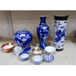 A Chinese blue and white inverted baluster vase height 8"; a cylindrical blue and white crackle