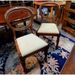 A Victorian set of 6 mahogany dining chairs with balloon backs and cream damask drop in seats, on