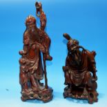 A Chinese carved hardwood group sage with staff and child, height 12", a similar seated sage