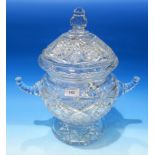 A cut crystal large covered punch bowl and glassware