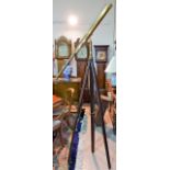 A 19th century brass Library Telescope with folding tripod mount and full height mahogany tripod,