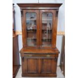 A Victorian walnut full height bookcase, the upper section with 2 glazed doors, frieze drawer and