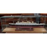 . A kit model of RMS Titanic in glass case, 31”