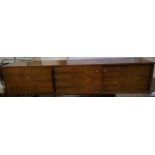 A 1960's rosewood floating sideboard by Robert Heritage for Archie Shine, with sliding doors and 4