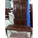 A Reprodux style corner cupboard; A G plan regency style mahogany long coffee table