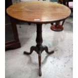 An early 19th century circular mahogany occasional table on baluster column and 3 splay feet