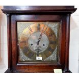 A mid-18th century oak longcase clock, the square top hood with side pillars, full length door,