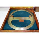 A 20th century brass 360 degree protractor, ex Ministry, by C S (C) Ltd, stained wood storage case