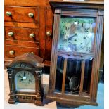 An Edwardian oak cased striking mantel clock; a 1930's oak cased wall clock