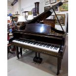 A baby grand piano, mahogany cased, iron framed and overstrung, by Kessel, with stool