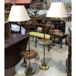 An early 20th century pair of brass adjustable standard lamps/occasional tables