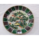 A Japanese Kutani shallow dish with alternating green and purple border, centre decorated with