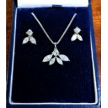 An 18 carat white gold pendant and earring set, 2 -2.5 carat approx