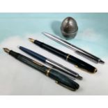 A Parker Slim fold fountain pen; a similar by Waterman; 2 Papermate ballpoint pens; a silvered egg