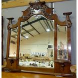 An Edwardian triple overmantel mirror in carved walnut frame