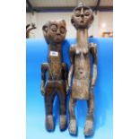 An African tribal carved match pair, male and female figures 20" and 24"