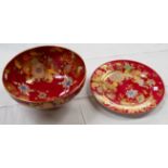 A Spode fruit bowl and plate with deep pink ground decorated with gilt and polychrome scrolls and
