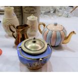 A Belleek vase; another similar covered vase, both with brown back stamps; a Solian ware covered