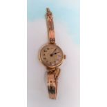 A 1920's analogue wristwatch with 9 carat hallmarked gold strap and case, gross weight 20 gm