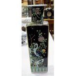 A large square tapering Chinese vase decorated in the famille noir pallet, with flower and trees,