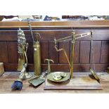 A set of 19th century brass scales and weights; a shell case; a spirit kettle; etc.