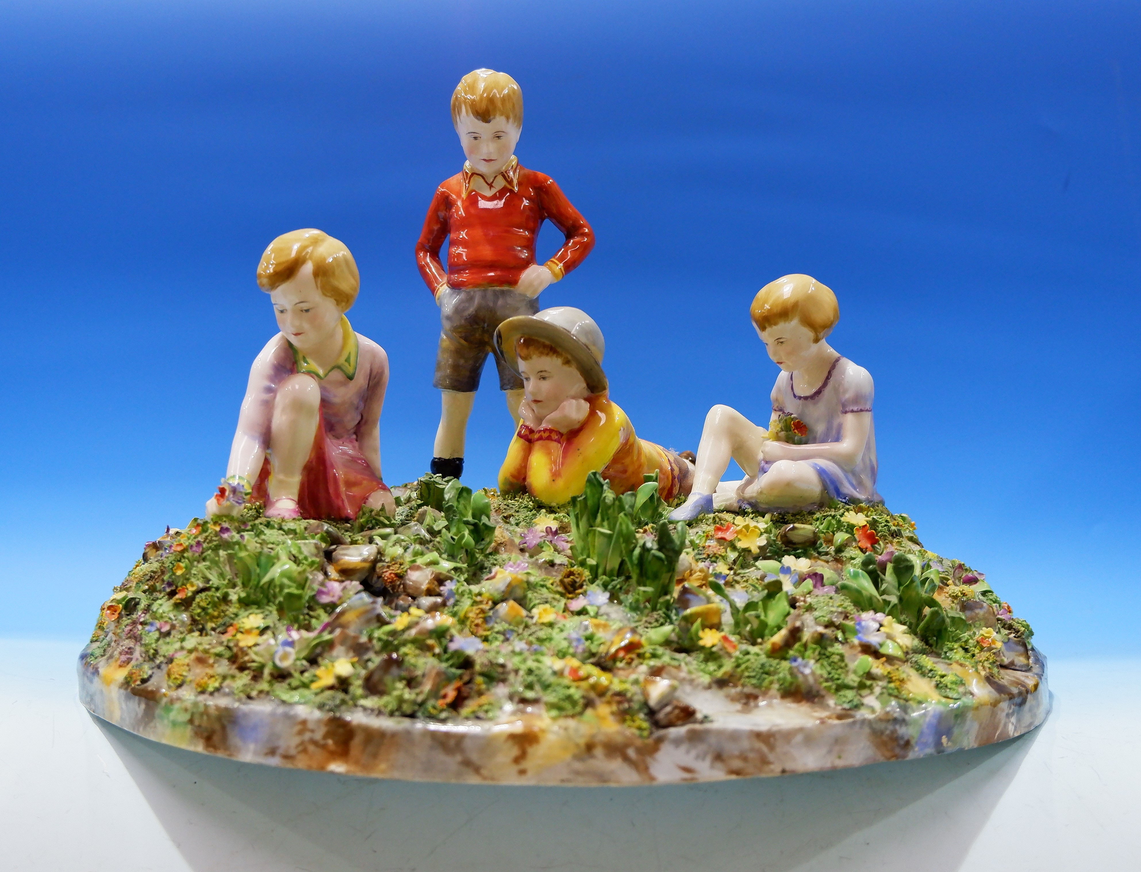 A large mid-20th century style Crown Staffordshire ceramic group depicting 4 children picking