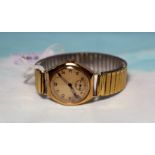 A 1950's gent's 9 carat hallmarked gold wristwatch with Arabic numerals, on expanding strap