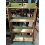 An Arts & Crafts golden oak 4 height bookcase