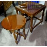 A nest of 3 quarter veneered coffee tables