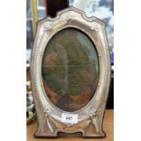 A silver ornate oval photo frame, height 12½"