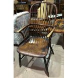 A 19th century elm and beech Windsor armchair with comb back; a 19th century ladder back armchair