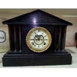 An architectural slate mantel clock with American striking movement and visible escapement