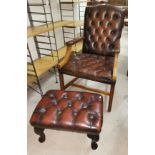 A gent's desk chair in buttoned brown hide, with matching footstool