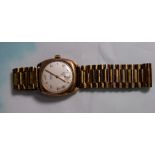 A 1950's/60's gent's 9 carat hallmarked gold wristwatch "Vertex Revue", on gold plated expanding
