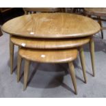 A 1950's Ercol elm and beech nest of 'pebble' tables