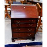An early 20th century mahogany Georgian style bureau with fall front and 4 drawers under
