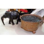 A large carved wood elephant; a brass coal bin