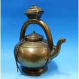 An 18th/19th Indian brass heavy brass teapot, on circular foot, raised handle with small covered