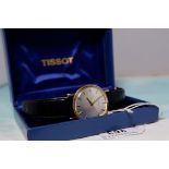 A gent's Tissot wristwatch with baton numerals, on leather strap, in original box