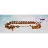 A rose coloured curb chain bracelet, large links, with safety chain and turquoise set fob,