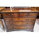A Georgian mahogany bachelors chest of three long and two short drawers on bracket feet with swan