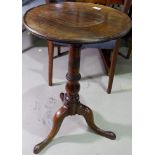 A mahogany wine table with circular dish top