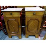 An early 20th century French pair of stained wood pot cupboards