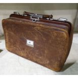 A doctor's leather bag; a stoneware display jar, 9½"