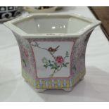 A 20th century Chinese hexagonal flared Chinese jardinière decorated in the famille rose pallet,
