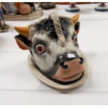 A novelty cow's head cheese dish; a wall hanging coffee grinder